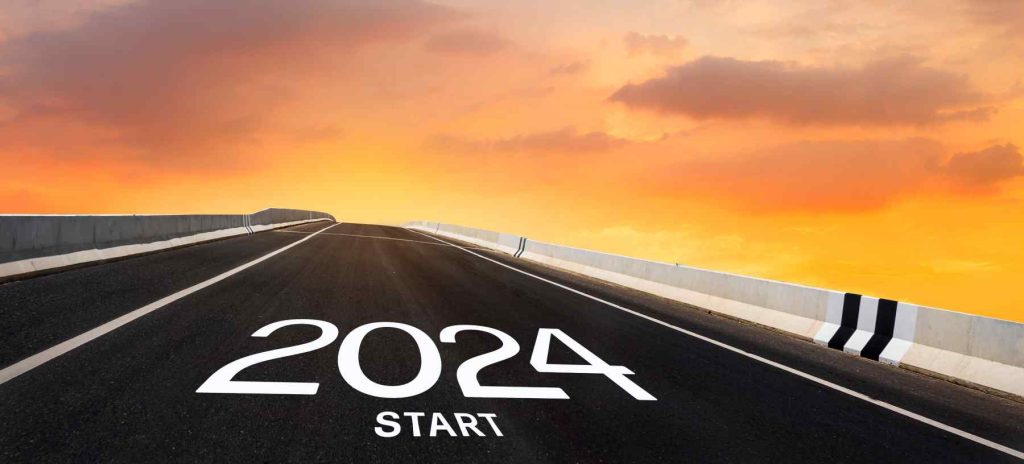 An open highway road with “Start 2024” painted on the ground